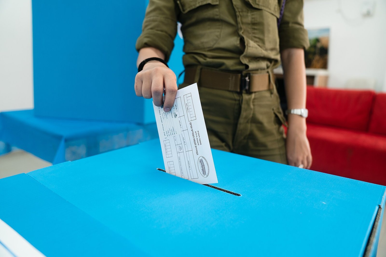 <em>An IDF soldier votes in the 2021 Israeli legislative election. Soldiers’ and”/><figcaption><em>An IDF soldier votes in the 2021 Israeli legislative election. Soldiers’ and out-of-station ballots are counted last, and can still move a seat. Photo: IDF Spokesperson’s Unit, CC BY-SA 3.0, via Wikimedia Commons</em></figcaption></figure>
<h3>The 18 seats nobody can spend</h3>
<p>The decisive number is not 52 or 53. It is 61. On the revised figures Netanyahu’s bloc is 11 short and the change bloc is nine short. The Arab parties’ 18 seats would close either gap instantly — 52 plus 18 is 70 — but the Jewish partners in Eisenkot’s bloc have ruled out a government that depends on Arab support, and Ra’am’s own MKs say it is too early to talk about red lines. So the largest Arab representation in Israeli history, 18 seats or 15% of the house against a previous high of 15 in 2015, buys nothing in coalition arithmetic this week.</p>
<p>What remains are the combinations nobody campaigned on. From Channel 12’s numbers, a Netanyahu-Eisenkot unity government starts at 46 seats and reaches 69 by adding B’Yachad at 13 and the Democrats at 10 — eight above the line. A Netanyahu-led coalition that keeps his current partners but swaps in Yashar is arithmetic too: 50 minus Likud’s 24 leaves 26, plus 24 plus 22 is 72. Both routes require the two men who spent the campaign calling each other unfit to serve in the same cabinet.</p>
<h3>What the exit polls cannot tell you</h3>
<p>Exit polls are, in the broadcasters’ own framing, an indication rather than a result, and the official count is the one that assigns mandates. What the polls can tell you is where the movement came from: turnout up eight points, Arab parties up three seats on their 2015 high, Shas down from 11 seats in 2022 to six or eight by projection, and Likud still the largest single party at 24 to 25 seats even as its bloc loses 18. That combination — a party that wins and a bloc that loses — is why President Isaac Herzog’s post-certification consultations matter more than the raw count.</p>
<h3>What to watch</h3>
<ul>
<li>The official count and the late-arriving special ballots, which can move one seat across the 3.25% threshold and change both blocs.</li>
<li>Whether Bennett, Lapid and Liberman hold their refusal to sit in a government backed by the Joint List — the single red line that keeps 70 seats unusable.</li>
<li>Herzog’s consultations after November 4, which decide who receives the first mandate to form a government.</li>
<li>Itamar Ben Gvir’s public warning against a unity government with Eisenkot, and whether it becomes a threat to bring any such coalition down from outside.</li>
<li>Turnout in Arab towns: 18 seats is the largest structural change of the night, and the least priced in by either camp.</li>
</ul>
<p><em>Sources: <a href=