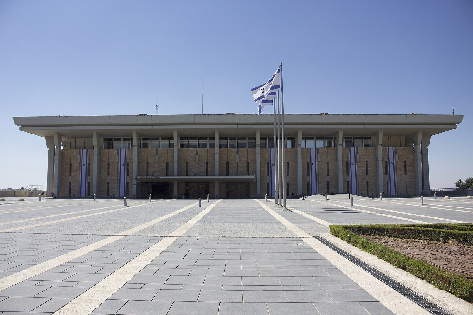 <em>The Knesset in Jerusalem. Exit polls put the Netanyahu bloc at 50 seats and “/><figcaption><em>The Knesset in Jerusalem. Exit polls put the Netanyahu bloc at 50 seats and the change bloc at 52, with 61 needed to govern. Photo: Clema12, CC BY-SA 4.0, via Wikimedia Commons</em></figcaption></figure>
<h3>The arithmetic the published tables do not close</h3>
<p>The Jewish Telegraphic Agency published Kan’s full eleven-party breakdown: Likud 25, Yashar 21, B’Yachad 14, the Democrats 10, the Joint List 10, Yisrael Beytenu 8, Ra’am 7, Otzma Yehudit 6, United Torah Judaism 6, Shas 6 and the Religious Zionist Party 6. Add those numbers and you get 119 — one short of the Knesset.</p>
<p>The same article’s prose gives the Netanyahu bloc 50 seats, the change bloc 53 and the Arab parties 17, which adds to exactly 120. Both cannot be right. Group the table by camp instead: Netanyahu’s 25 plus four allied parties at six seats each comes to 49, not 50; the change bloc’s 21 + 14 + 10 + 8 comes to 53, matching the copy; the Joint List and Ra’am come to 17, also matching. So one seat in the published party rows is either mis-keyed or double-counted in the bloc line. In a house where the majority threshold is 61, that single seat is the whole election-night narrative.</p>
<h3>Where the broadcasters contradict each other, hour by hour</h3>
<ul>
<li><strong>22:00, polls close.</strong> Kan 11 projects 50 seats for the Netanyahu bloc and 53 for the change bloc, with 17 for the Arab parties. Channel 12 projects 50 and 52, with 18 Arab seats. Channel 13 projects 50 and 53. Channel 14, which is openly aligned with Netanyahu, projects 60 against 43 and gives Likud 30.</li>
<li><strong>Within the hour.</strong> Kan revises. B’Yachad falls from 14 to 13, the Joint List rises from 10 to 11. The blocs become 50 and 52, and the Arab parties reach 18 — the record that every headline then repeats.</li>
<li><strong>The same window, different wire copy.</strong> DW, JTA and NBC’s live blog carry Kan at 53. The Times of Israel, CNN and the Washington Post carry the revised 52 with 18 Arab seats. All four are quoting “the Kan poll”, roughly sixty minutes apart.</li>
<li><strong>November 4.</strong> Certification. Soldiers, diplomats and voters who cast ballots away from their home stations are counted last, and a single seat can still cross a threshold.</li>
</ul>
<figure class=