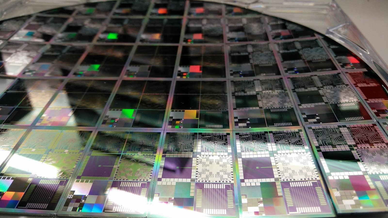 <em>A processed semiconductor wafer. Chipmakers CXMT, MetaX and Moore Threads ha”/><figcaption><em>A processed semiconductor wafer. Chipmakers CXMT, MetaX and Moore Threads have led the selloff. Photo: DrHughManning, CC BY-SA 4.0, via Wikimedia Commons</em></figcaption></figure>
<h3>Beijing is buying what retail is selling</h3>
<p>The policy tape points the other way from the price tape. A state-backed AI investment fund worth 60 billion yuan was launched this month. The securities regulator has tightened rules on leverage and high-frequency trading. State-linked investors have been sellers into rallies, taking profits rather than defending levels, and no major stimulus is expected before this week’s fifth plenum or next year’s party congress. Foreign houses are split: HSBC research has Asia funds overweight China, and Goldman put Innolight and CXMT on a refreshed recommendation list this month.</p>
<p>Read together, that is not a floor. It is a regulator trying to convert a speculative bull into what officials call a “slow bull” — and, on the evidence of a 40% drawdown in under four months, losing the argument.</p>
<h3>Who should not buy this dip</h3>
<ul>
<li><strong>Anyone assuming the 100-to-30 gap closes through price.</strong> It requires profits to triple. Nothing in the policy response delivers that, and a 40% fall leaves the index at three times the Nasdaq multiple.</li>
<li><strong>Anyone treating the STAR50 as “China tech”.</strong> It is fifty names, weighted to AI and semiconductors, fed by a listing pipeline that produced 8,000-times oversubscription. It is a momentum vehicle, not a broad exposure.</li>
<li><strong>Anyone reading the state fund as a backstop.</strong> The same state-linked vehicles were sellers into strength, and the regulator is deliberately squeezing the leverage that drove the rally.</li>
</ul>
<p>The verdict flips — the dip becomes defensible — if forward earnings growth holds above 40% for three years while the multiple stays flat, or if Washington’s component ban lands narrow and final instead of widening. In the first case the gap closes by 2029; in the second, the export-risk premium comes out of the optical and chip names. Short of either, buying a 100x index after a 40% fall is a bet on execution, not a discount.</p>
<h3>What to watch</h3>
<ul>
<li>Language from this week’s fifth plenum on tech investment and on crackdowns against “involution” pricing.</li>
<li>Whether Washington finalises the data-centre component ban — the optical names are hostage to it.</li>
<li>The STAR50’s trailing multiple: at 100x there is a long way to fall before it screens cheap against 30x.</li>
<li>The November listing calendar. A state-backed IPO pricing below its last private round would confirm the funding channel is closing.</li>
<li>HSBC’s next Asia positioning survey: if overweight turns neutral, the dip-buyers have left.</li>
</ul>
<p><em>Sources: <a href=